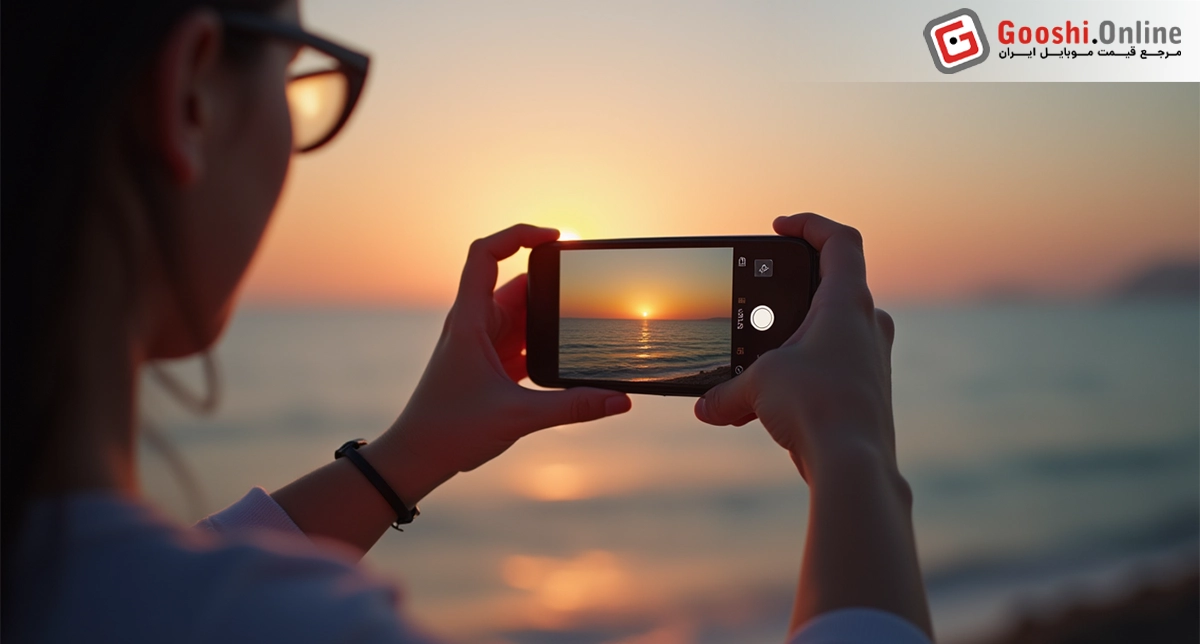 یک شخص درحال عکاسی با گوشی آنر